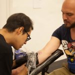 Carlos Olvera tattooing at Dolor Local x Platoon Mexico City. Photo Rodrigo Vázquez Guerrero.